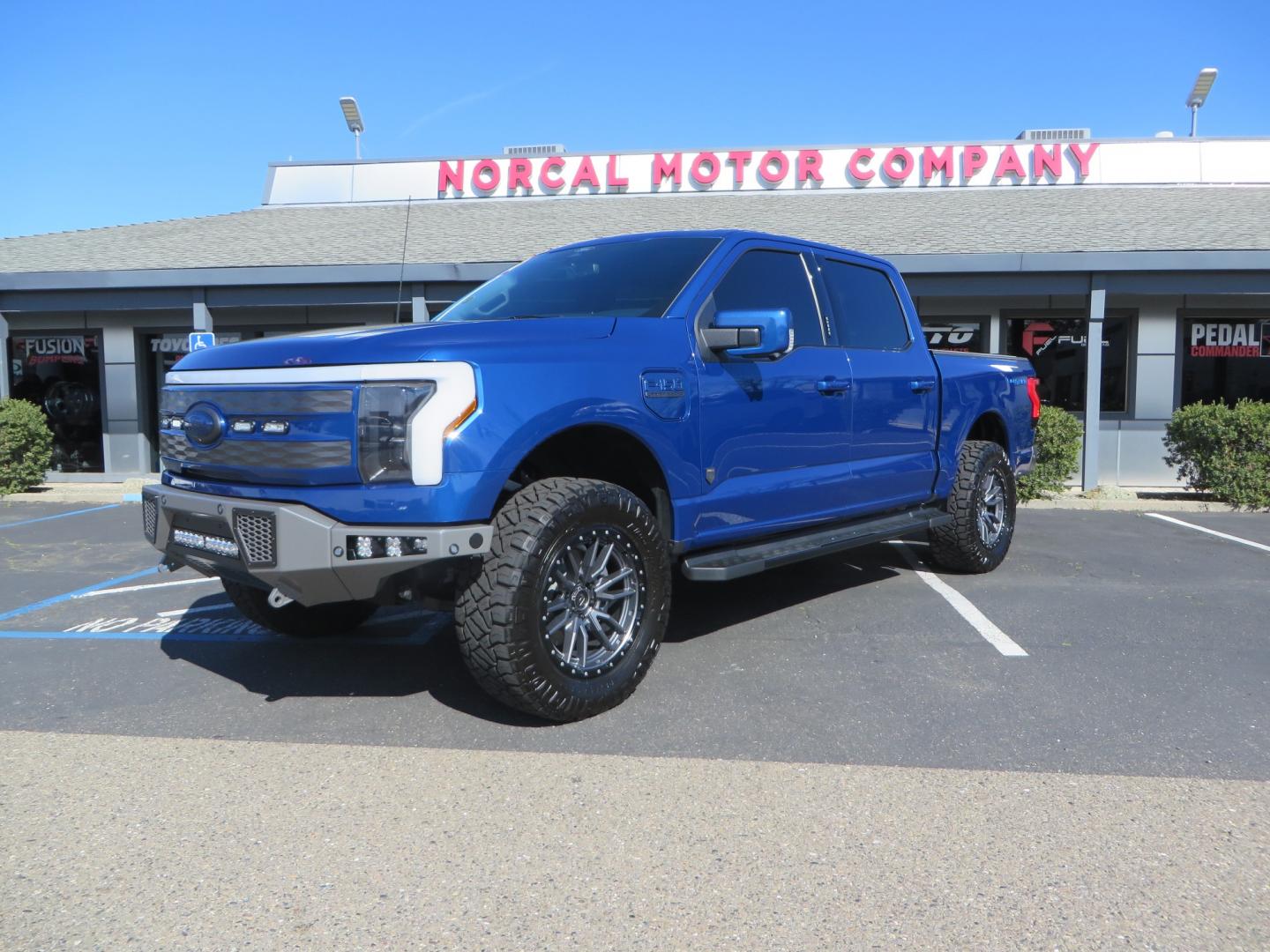 2022 BLUE /BLACK Ford F-150 Lariat Crew Cab 4WD (1FT6W1EV6NW) , located at 2630 Grass Valley Highway, Auburn, CA, 95603, (530) 508-5100, 38.937893, -121.095482 - Tired of gas prices and still want to look cool? Check out this Ford Lightning featuring a RC level kit, Nitto Ridge Grappler tires, Fuel Rebel wheels, Sinister front and rear bumpers, Baja Designs leds, Rigid Industries Leds, Bakflip F1, and window tint. - Photo#0